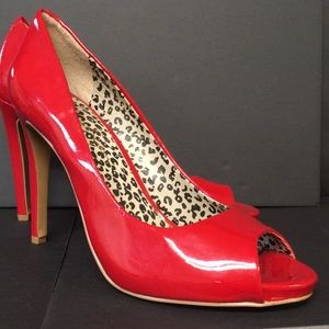 Red hot 3 inch heels. Scuff on right heel.